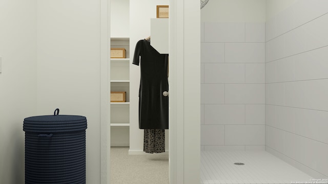 bathroom with a tile shower