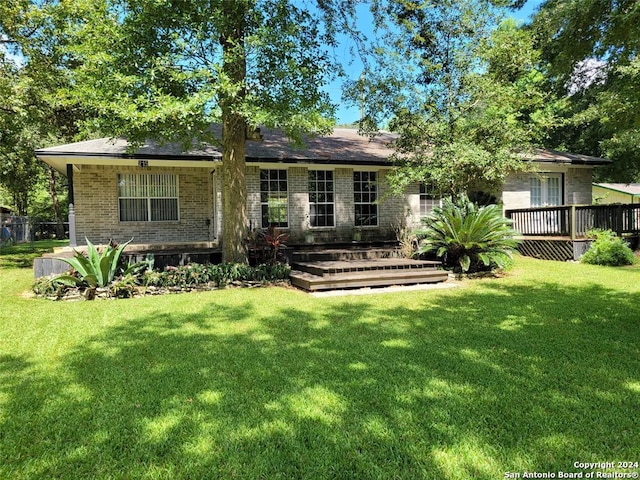 back of house with a yard and a wooden deck