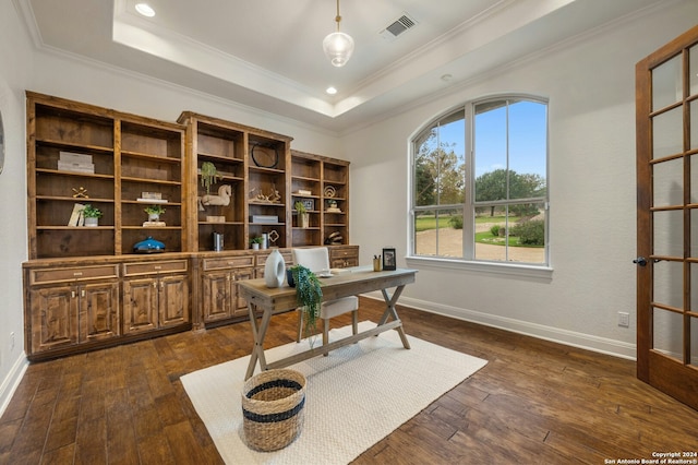 office space featuring a tray ceiling, dark hardwood / wood-style floors, and ornamental molding