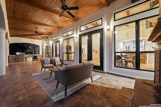 view of patio / terrace with french doors, a grill, ceiling fan, and exterior kitchen