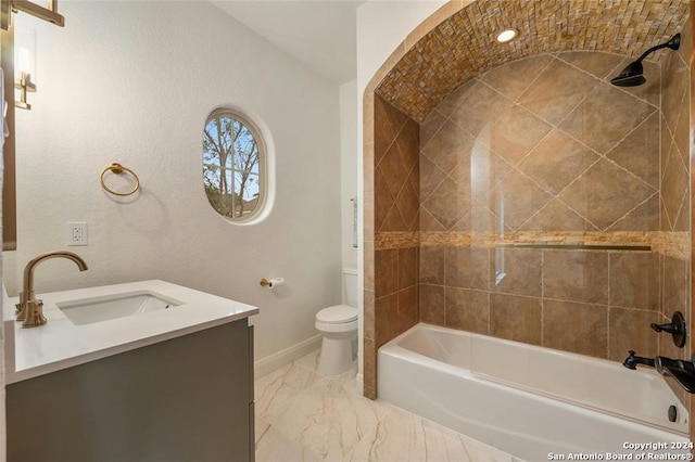 full bathroom with vanity, toilet, and tiled shower / bath combo