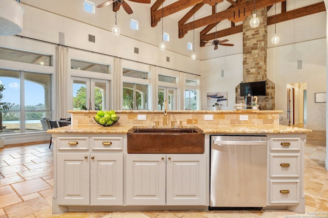 kitchen with dishwasher, beam ceiling, white cabinetry, and high vaulted ceiling