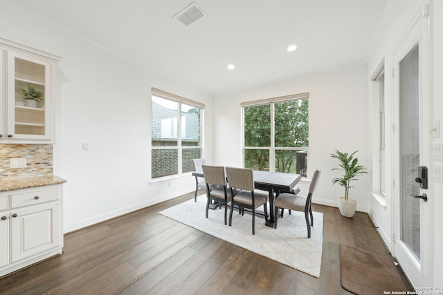 dining space featuring dark hardwood / wood-style floors