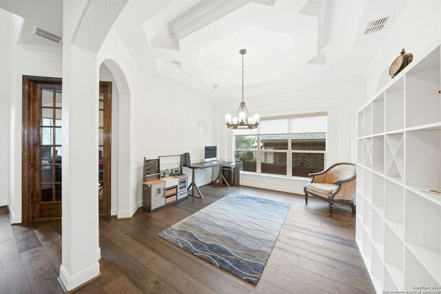 sitting room with a notable chandelier, dark hardwood / wood-style flooring, ornamental molding, and coffered ceiling