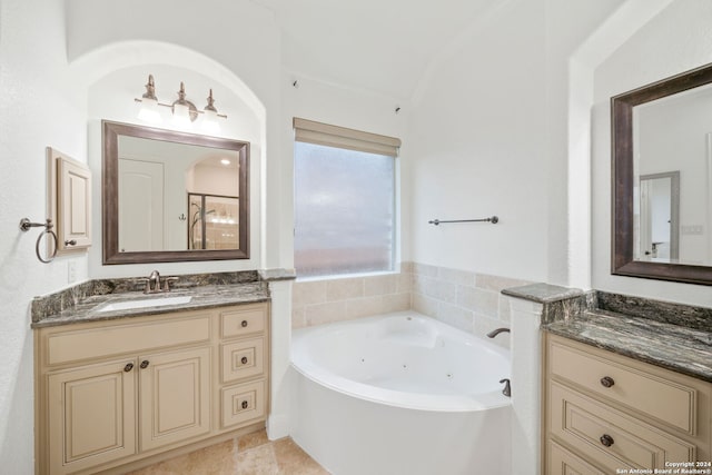 bathroom featuring vanity and a bath