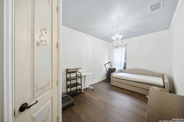 bedroom with dark hardwood / wood-style flooring, crown molding, and an inviting chandelier