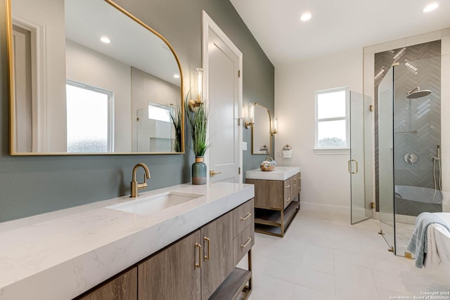 bathroom with a shower with door and vanity