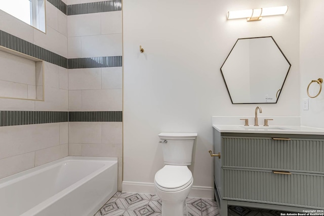 bathroom with tile patterned flooring, a bathtub, toilet, and vanity