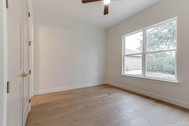 unfurnished room featuring light hardwood / wood-style flooring, plenty of natural light, and ceiling fan