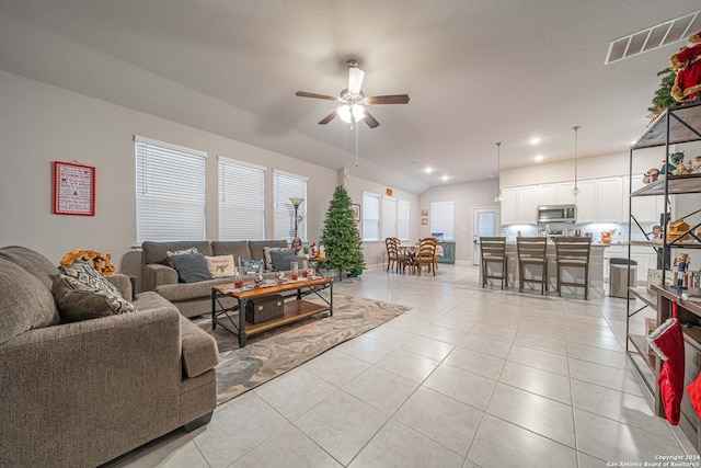 living room featuring ceiling fan and light tile patterned floors