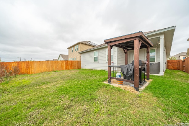 rear view of property featuring a lawn