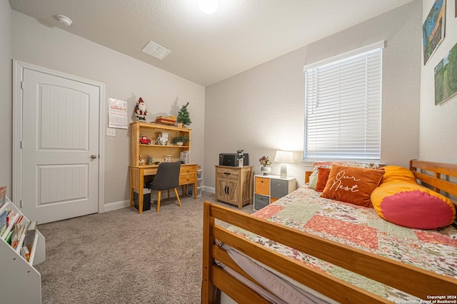 bedroom featuring light carpet