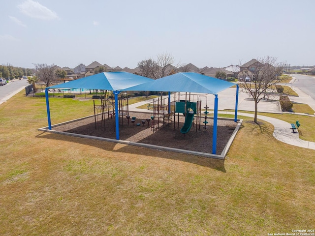 community jungle gym with a lawn