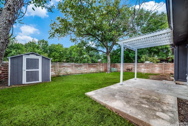 view of yard with a storage unit, a pergola, and a patio