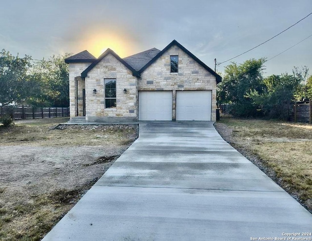 french country home with a garage