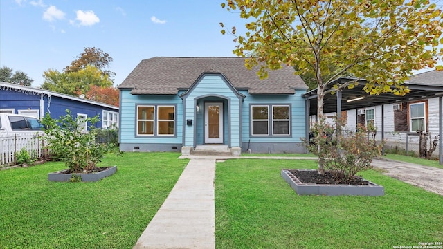 bungalow-style house with a front lawn