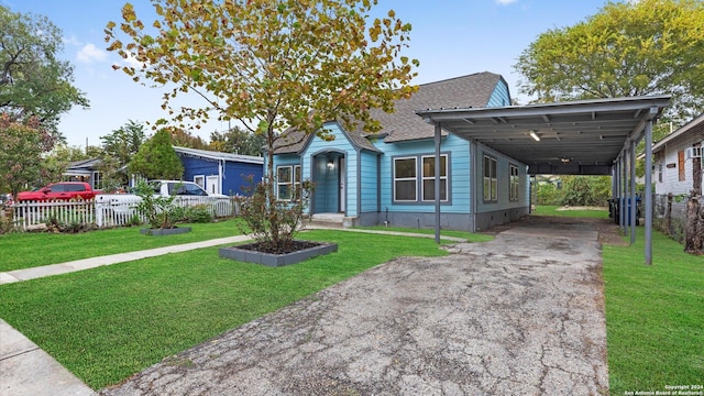 view of front facade featuring a front lawn and a carport