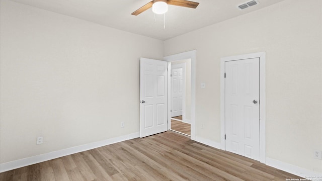 unfurnished bedroom featuring light hardwood / wood-style floors and ceiling fan