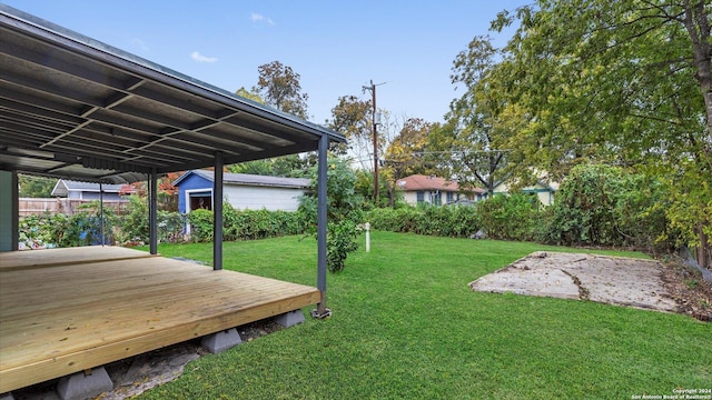 view of yard with a deck