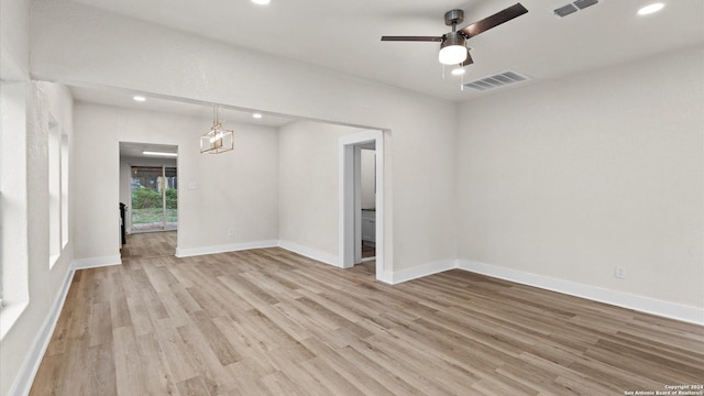 spare room featuring ceiling fan and light hardwood / wood-style floors