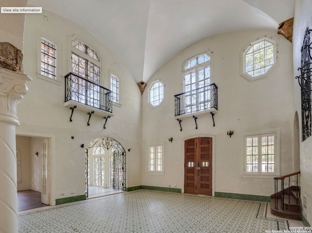 entrance foyer featuring a towering ceiling