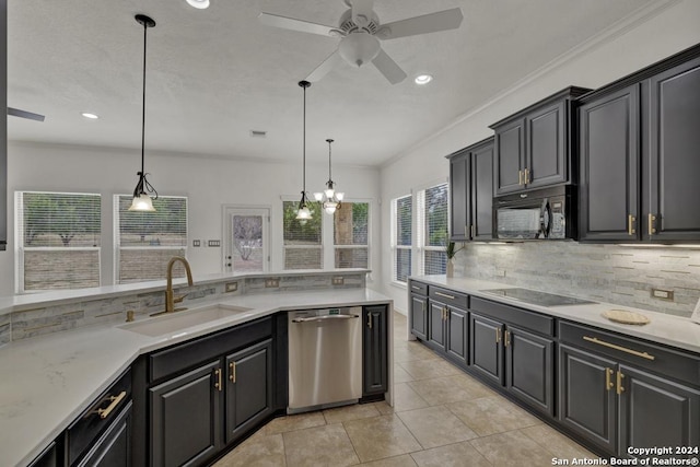 kitchen featuring sink, tasteful backsplash, hanging light fixtures, and black appliances