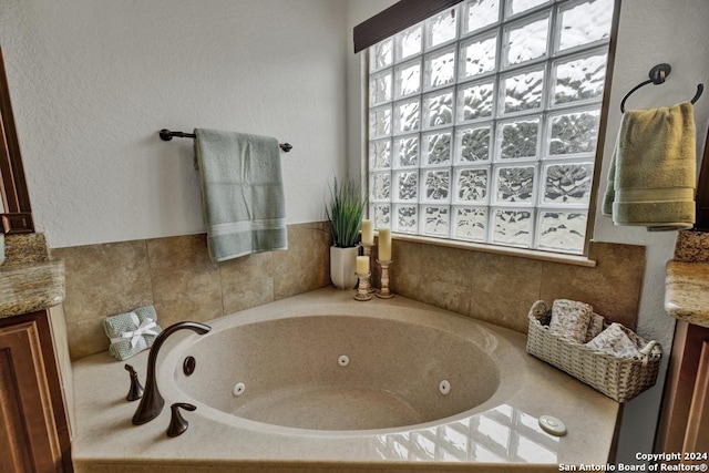 bathroom featuring a bathtub and vanity