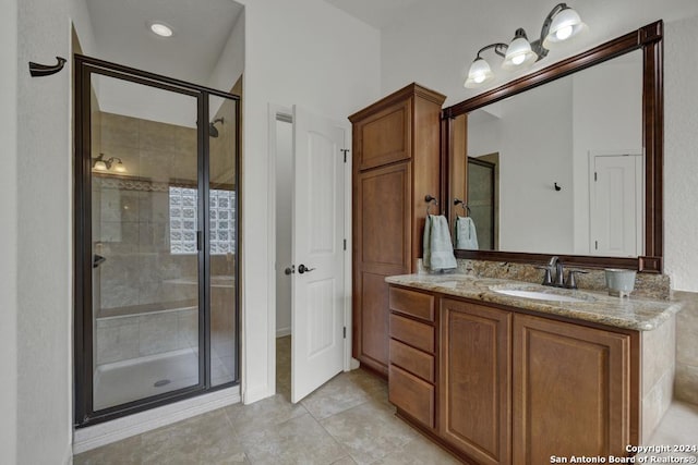 bathroom featuring vanity, tile patterned floors, and an enclosed shower