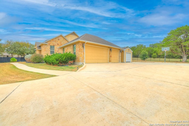 view of front facade with a garage and a front lawn