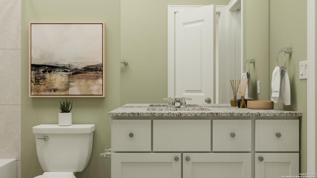 bathroom with vanity and toilet