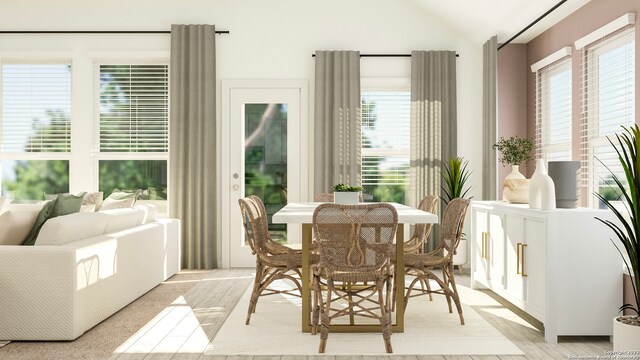 sunroom with plenty of natural light and lofted ceiling