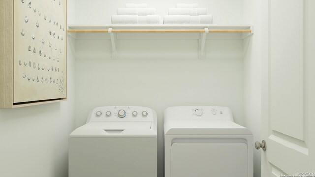 washroom featuring washer and clothes dryer