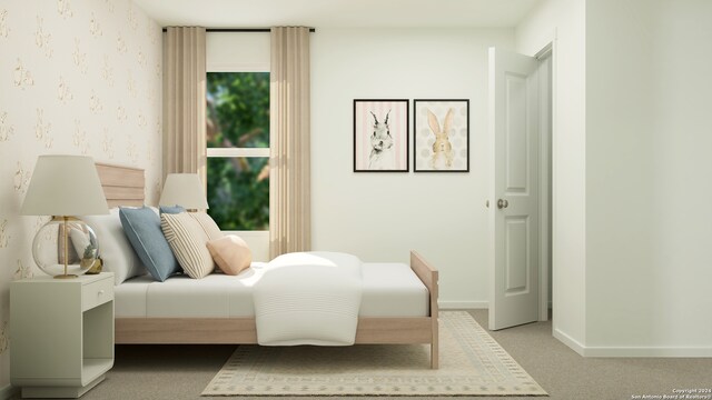 bedroom featuring light colored carpet