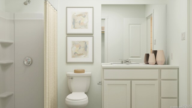 bathroom with a shower with curtain, vanity, and toilet