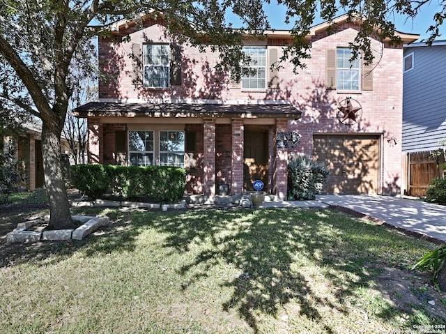 view of front of house featuring a front yard and a garage