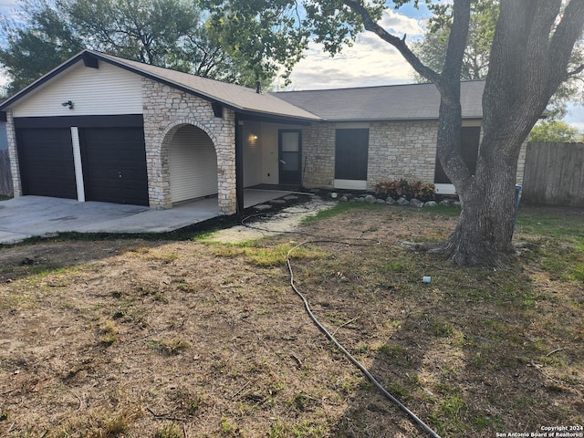 ranch-style home with a garage