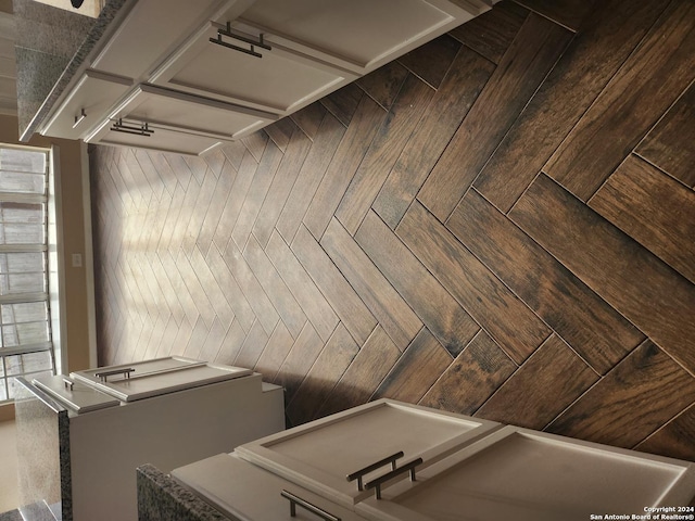 laundry room featuring parquet floors