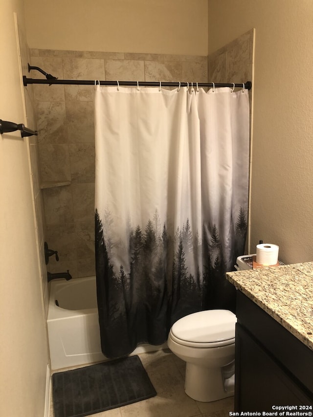 full bathroom featuring tile patterned floors, vanity, toilet, and shower / tub combo