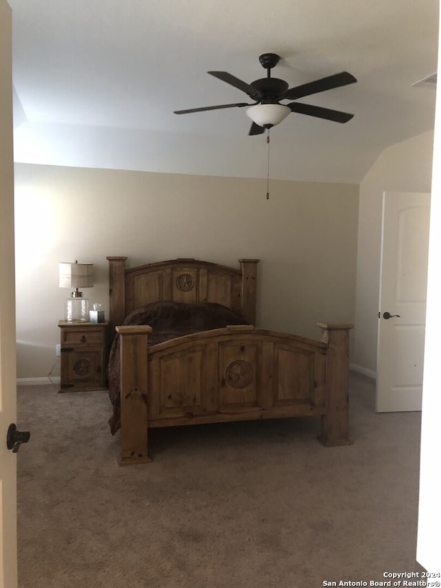 bedroom featuring ceiling fan, lofted ceiling, and light carpet