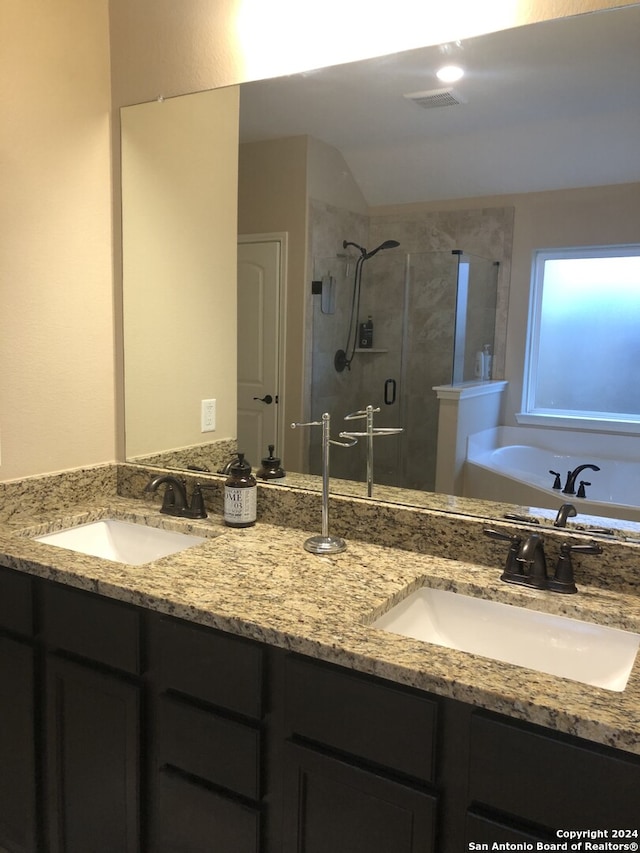 bathroom with plus walk in shower and vanity