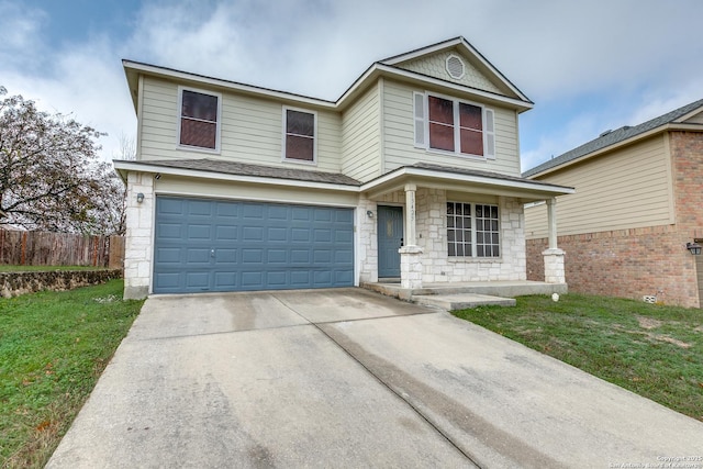 front of property with a front lawn and a garage