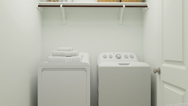 clothes washing area featuring washer and dryer