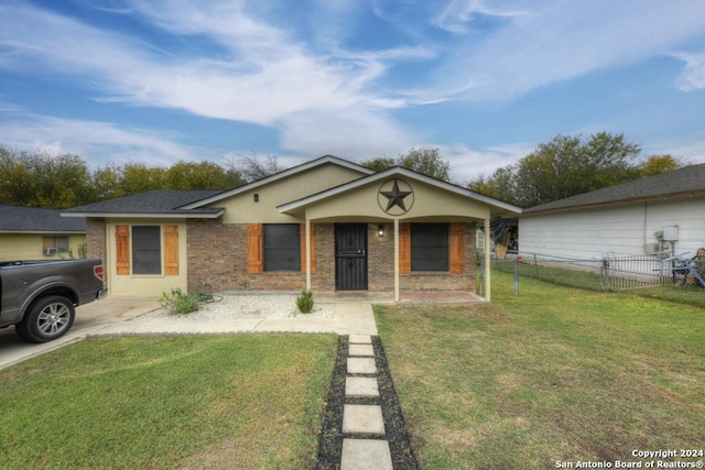 single story home featuring a front yard and covered porch