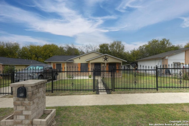 bungalow-style house featuring a front lawn