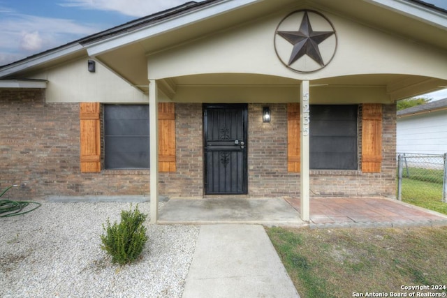 entrance to property with a porch