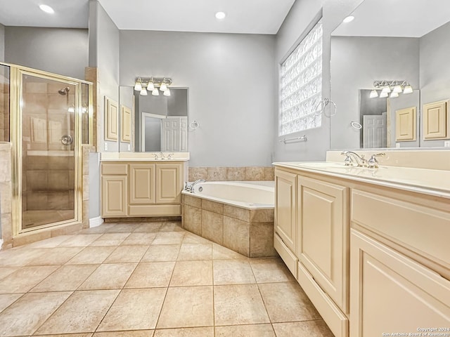 bathroom featuring tile patterned flooring, vanity, and separate shower and tub