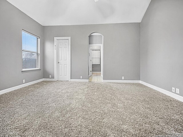 spare room featuring light colored carpet