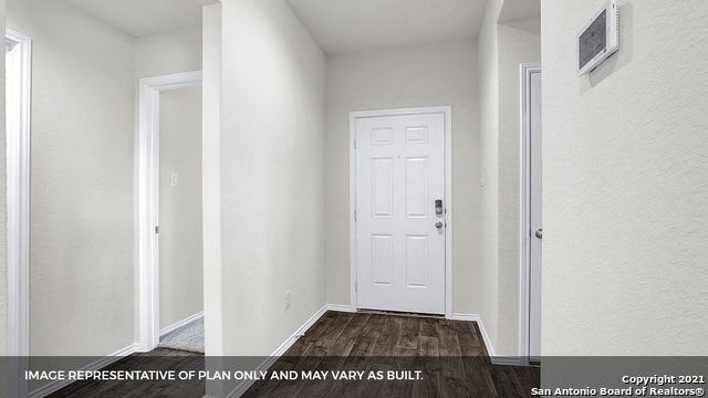 hall with dark hardwood / wood-style flooring