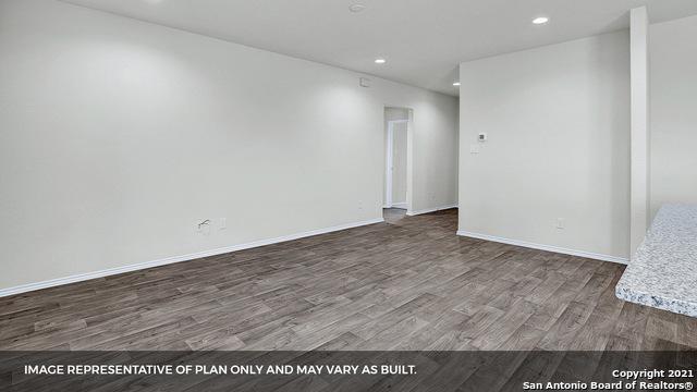 empty room with hardwood / wood-style flooring