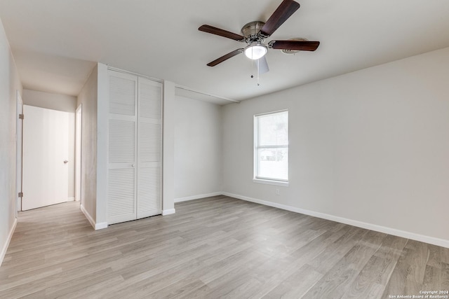 unfurnished bedroom featuring light hardwood / wood-style flooring and ceiling fan